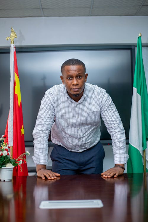 Foto profissional grátis de bandeira nigeriana, homem nigeriano, nigéria