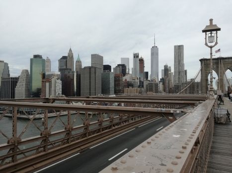 A stunning view of the New York City skyline from the Brooklyn Bridge, showcasing iconic skyscrapers.