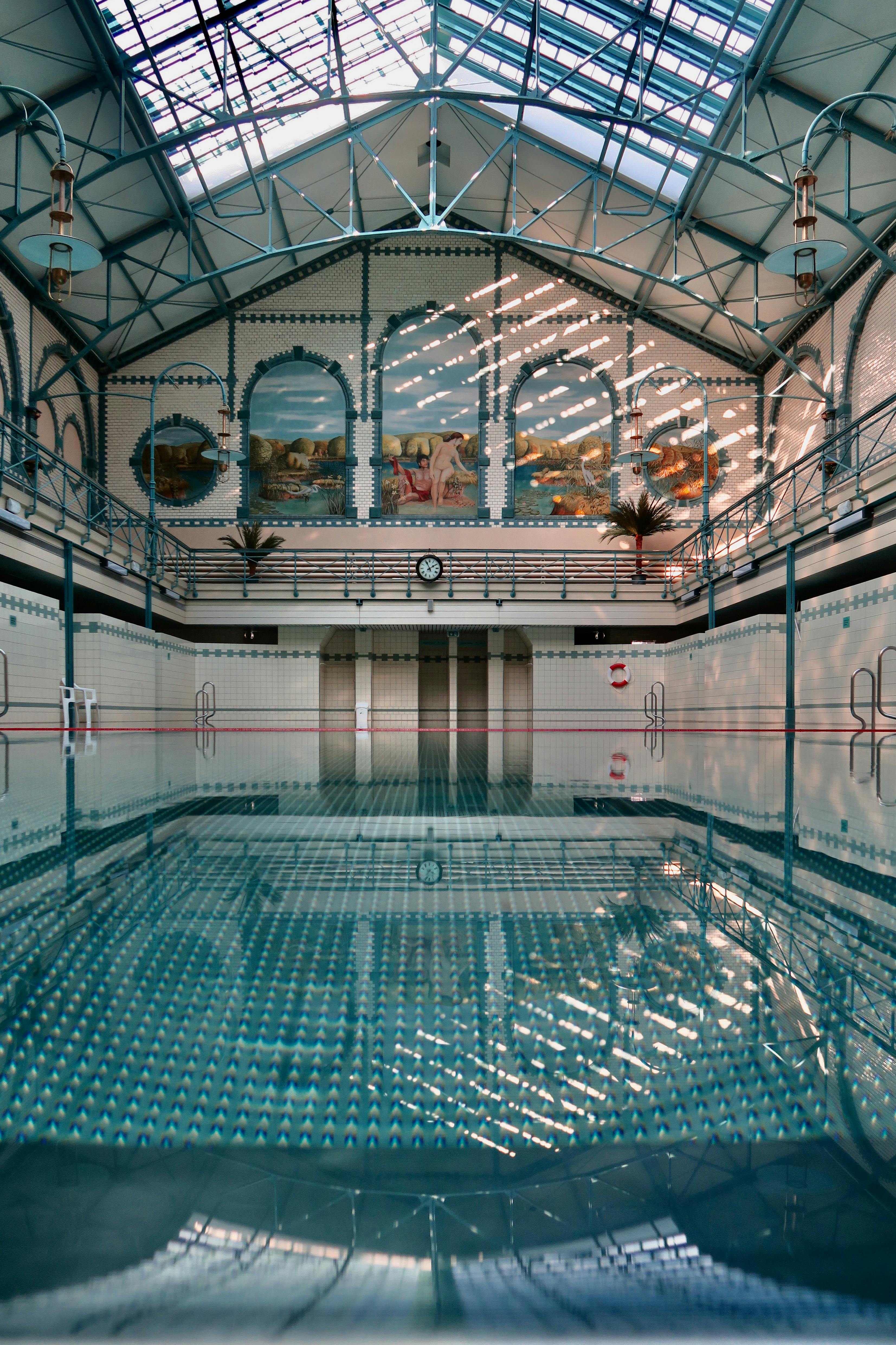 Explore the art nouveau architecture of Stadtbad Charlottenburg in Berlin, Germany. A historical indoor pool.