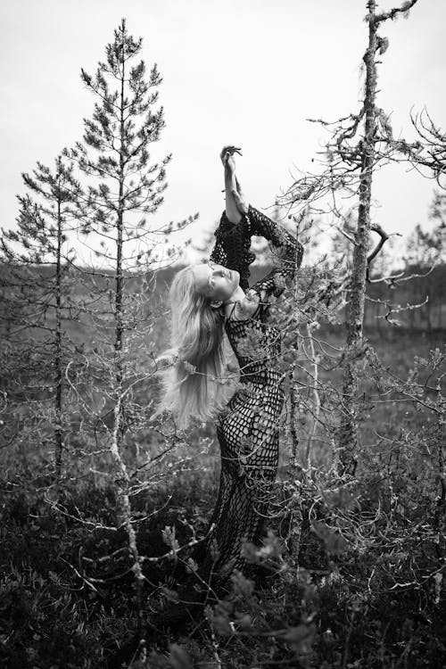 Young Woman Dancing in Nature