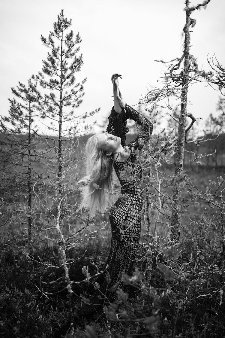 Young Woman Dancing In Nature