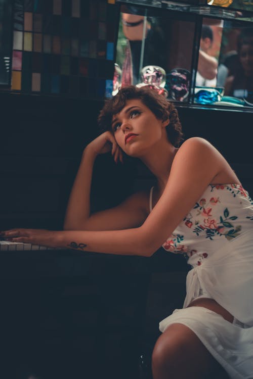 Woman Leaning and Posing on Piano
