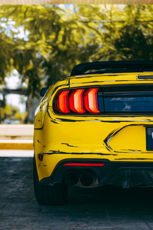 Back of a Yellow Ford Mustang 