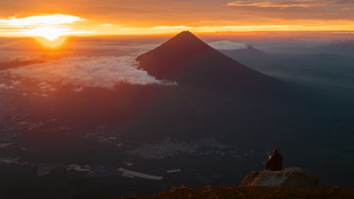 Aerial View of a Volcano and Clouds at Sunset