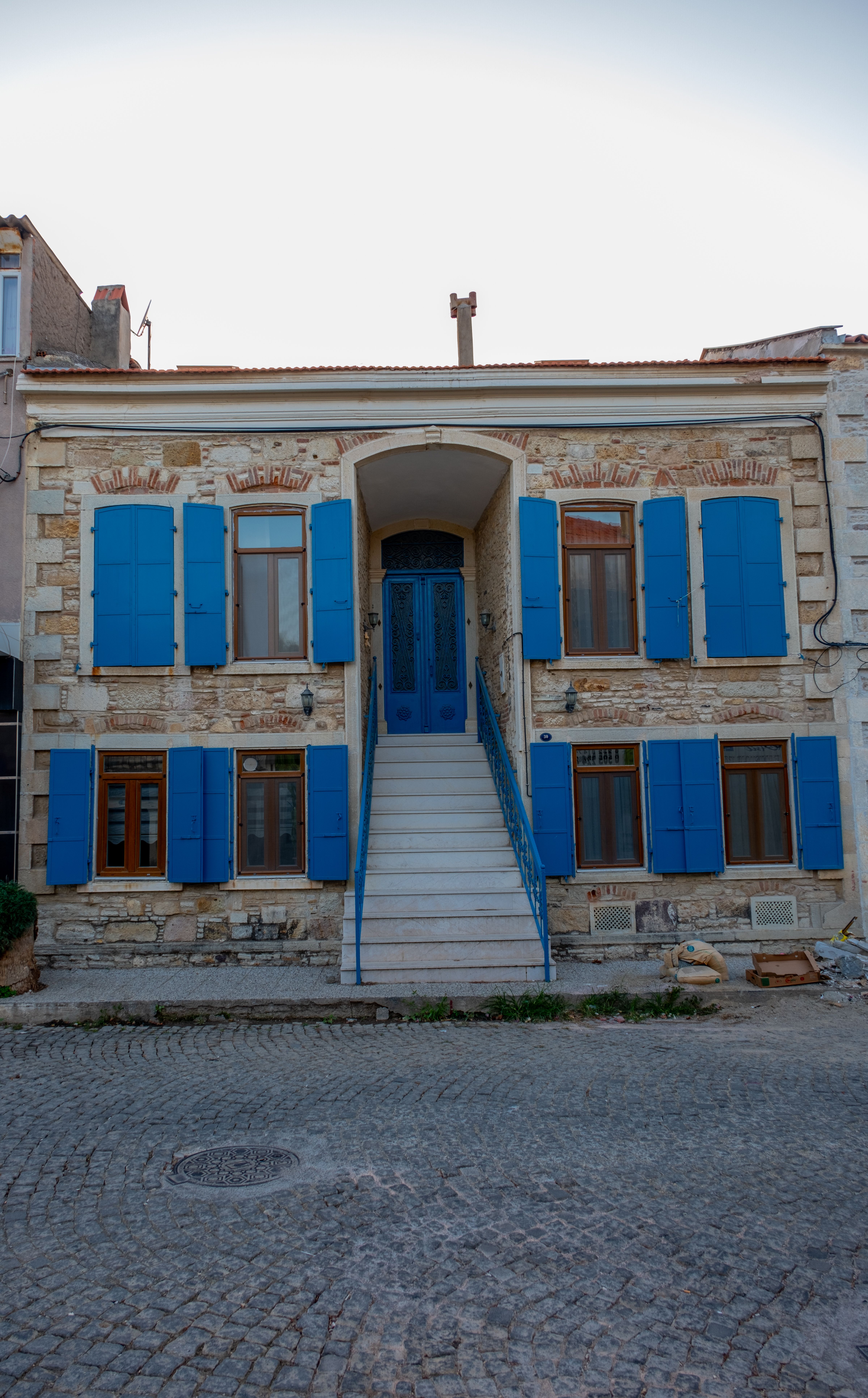 Facade of a House with Blue Window Shutters · Free Stock Photo
