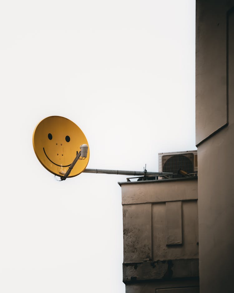 Satellite Dish With Smiley Emoticon