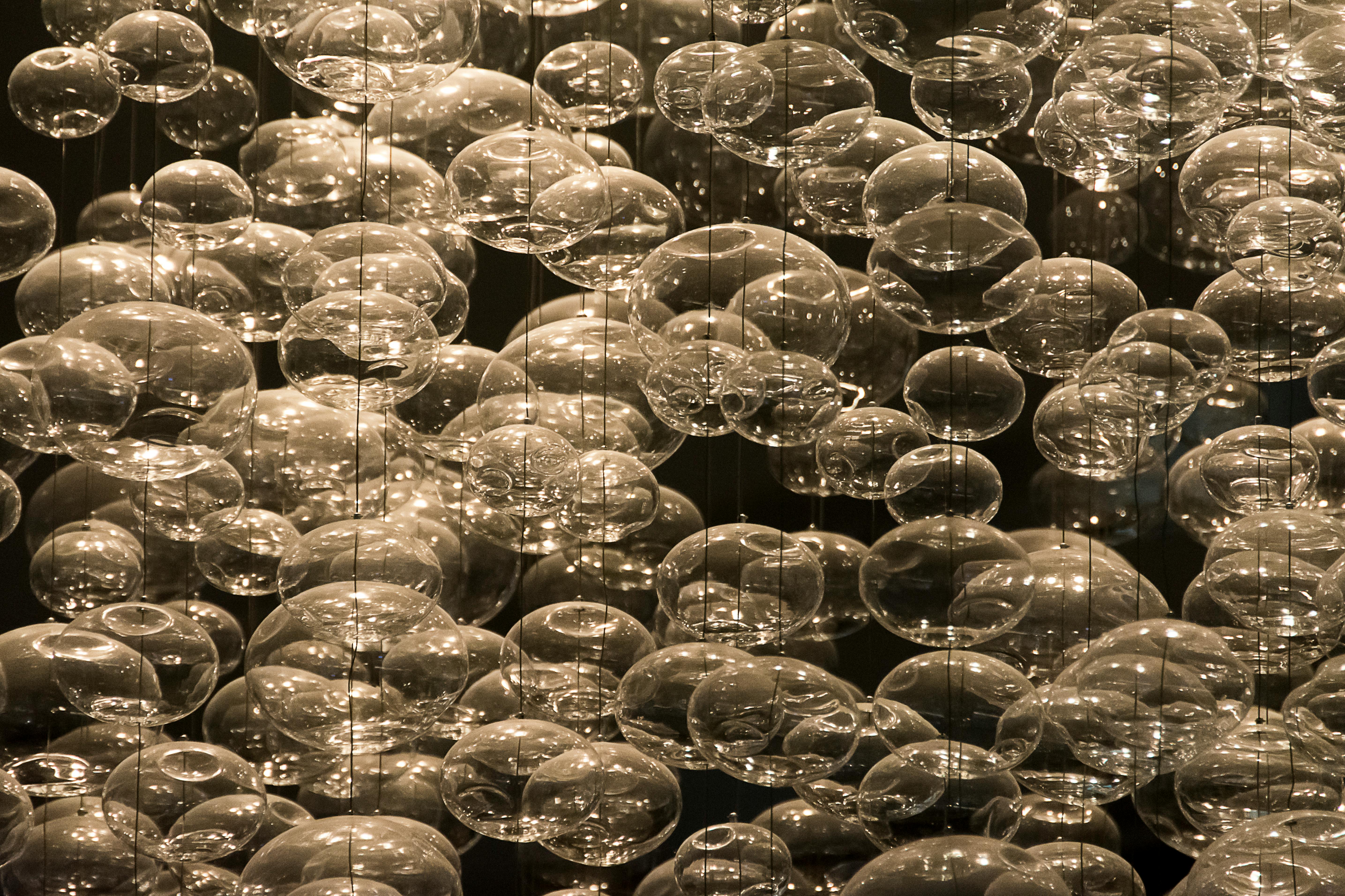 large variety of glass spheres hanging on strings