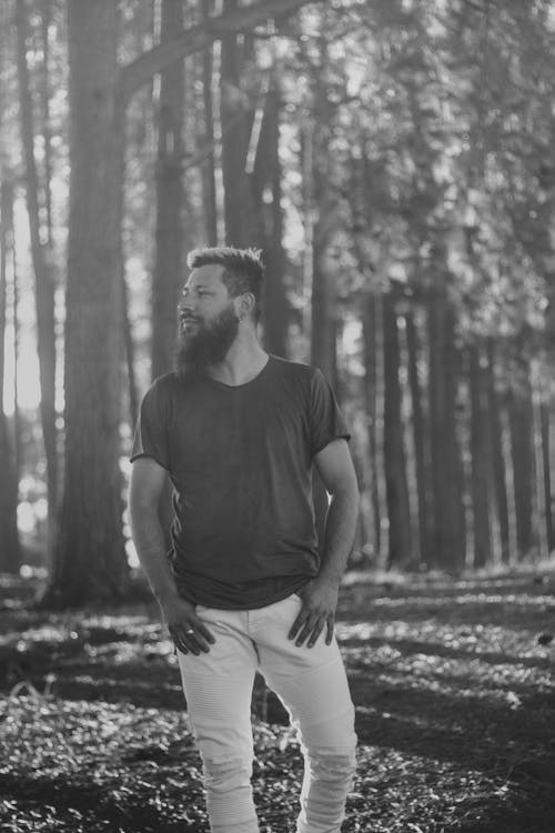 Bearded Man Standing in a Forest