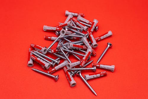 Screws on a Red Background