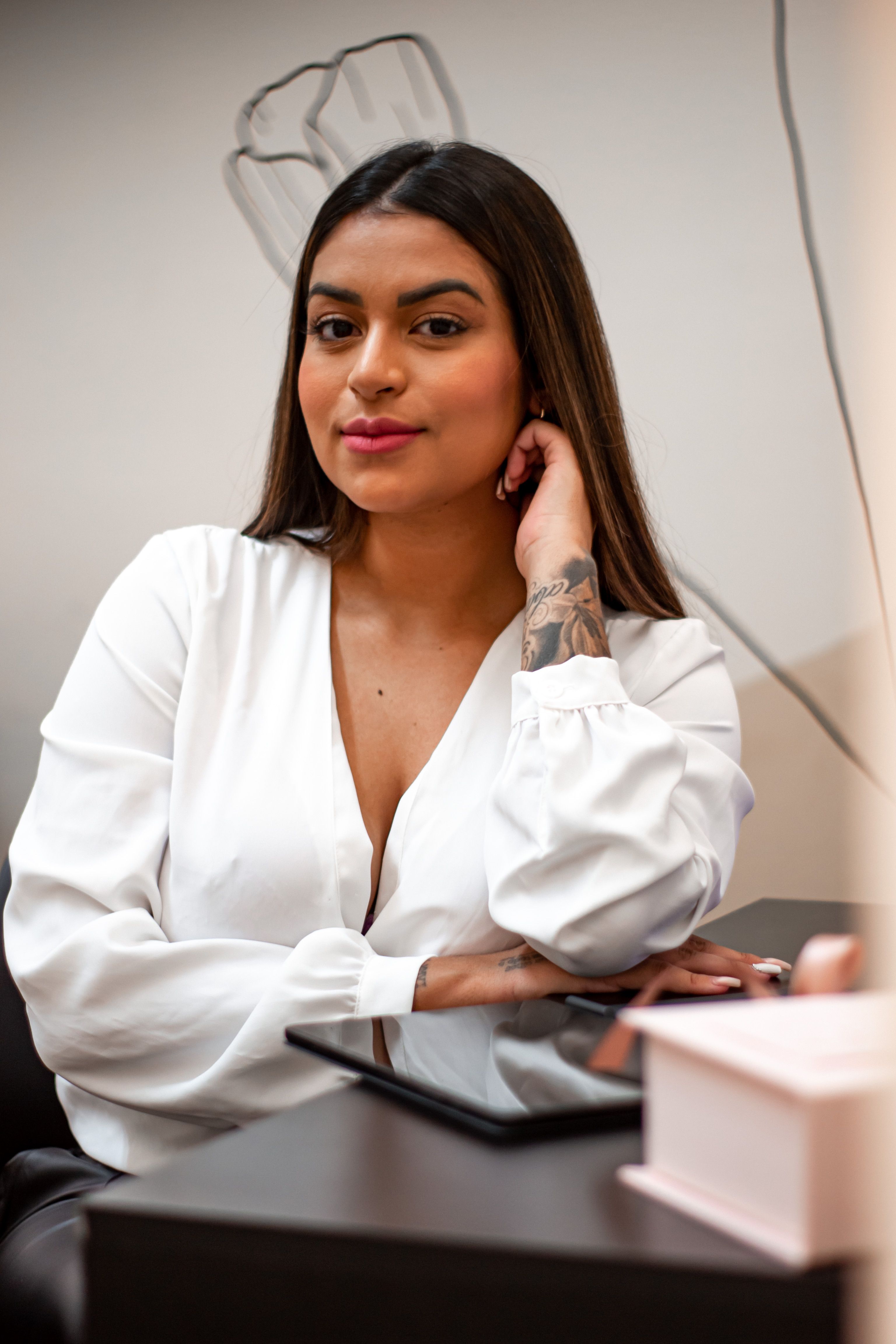 Portrait of a Woman Sitting Cross-Legged · Free Stock Photo