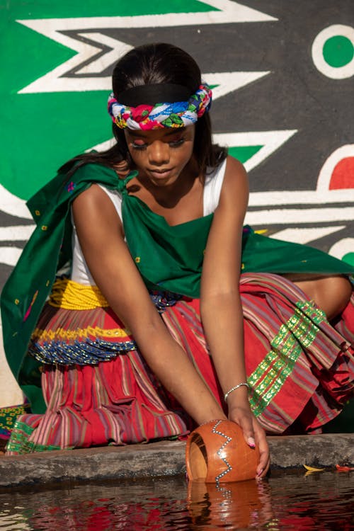 Portrait of a Woman Collecting Water 