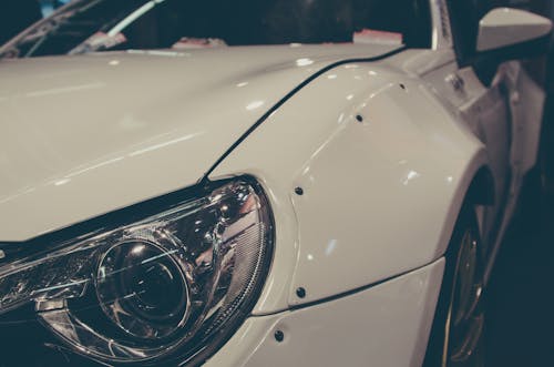 Close View of White Cars Left Headlight