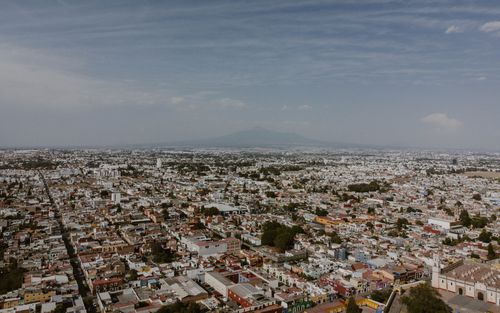 Free Breathtaking aerial view of Cholula, Mexico with mountains in the distance. Stock Photo