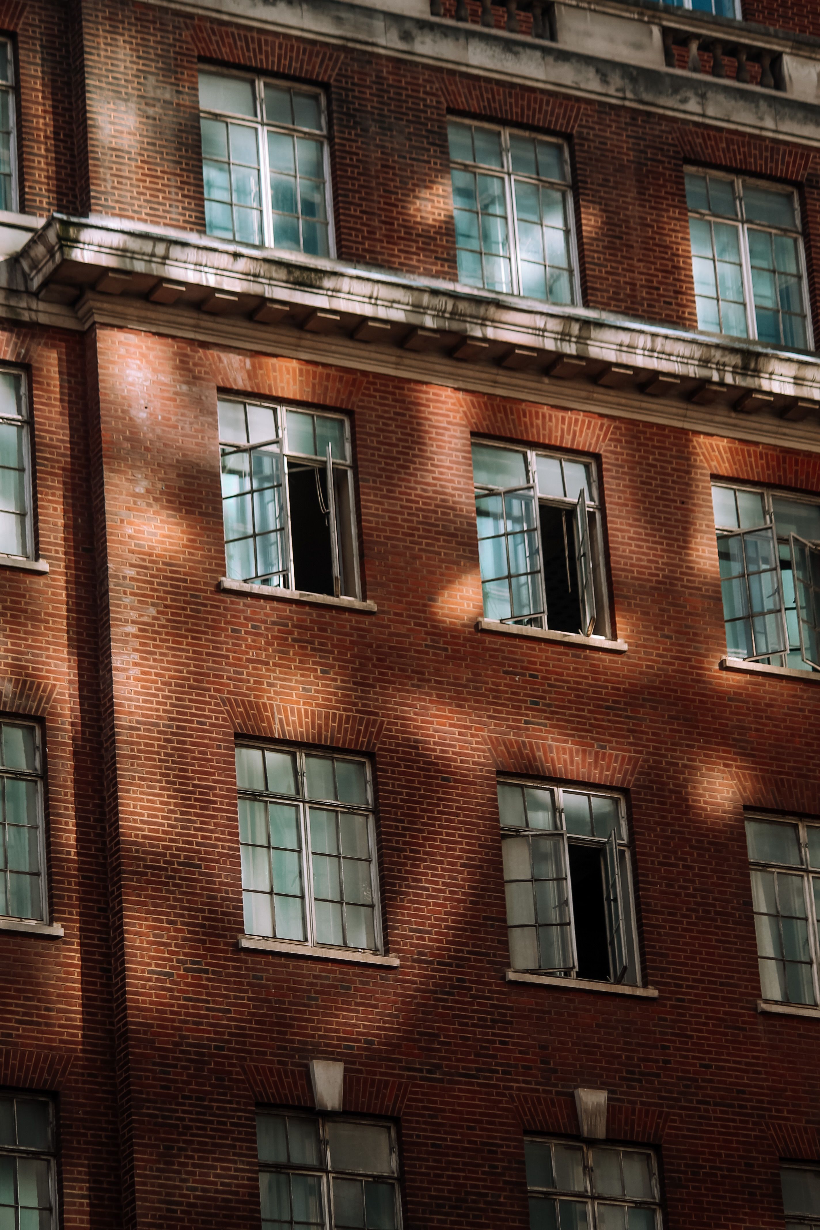 Brick Townhouse with Rows of Windows · Free Stock Photo