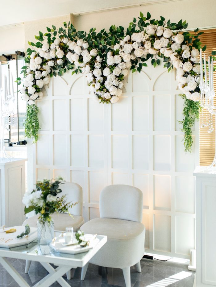 Lush floral arch with elegant seating