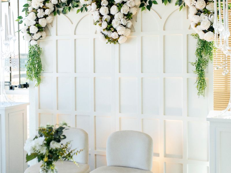 Lush floral arch with elegant seating