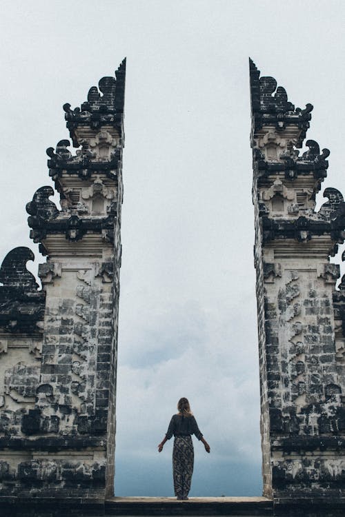 Woman Standing in Between Split Gateway