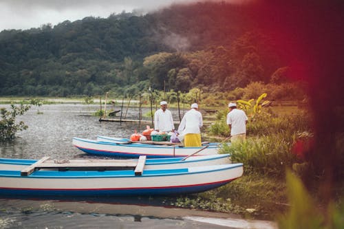 Men by Boats at Dock