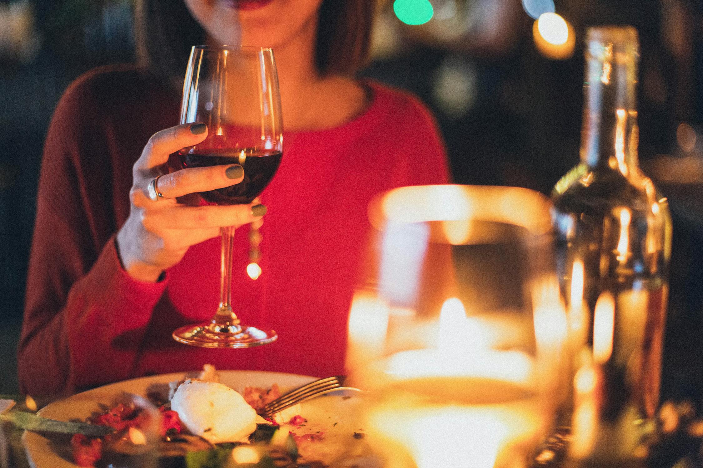 woman holding wine glass