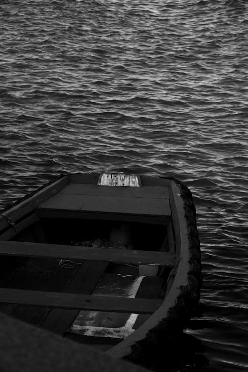 Black and White Photo of a Boat on the Sea