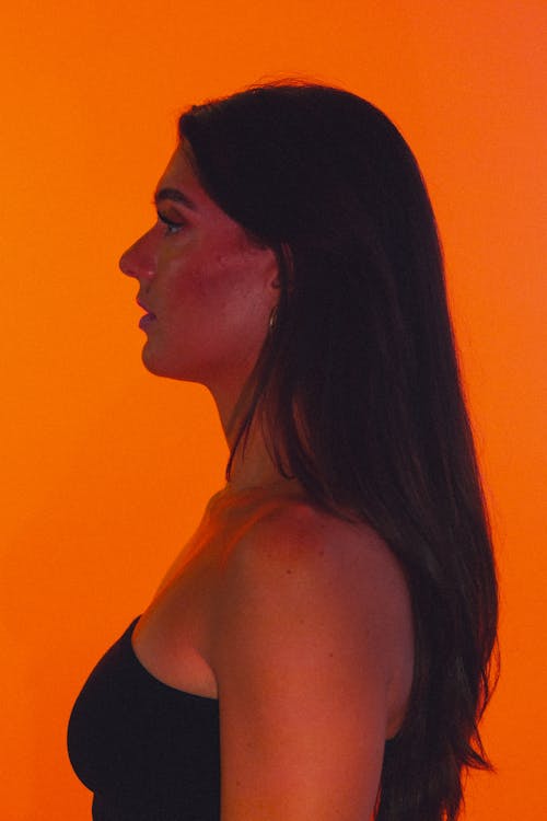 Free stock photo of brunette, orange, orange background