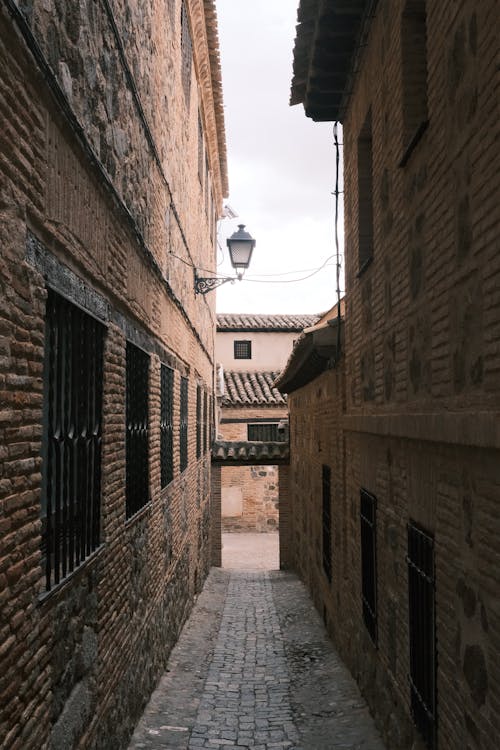 Narrow Alley among Stone Houses in Old Town