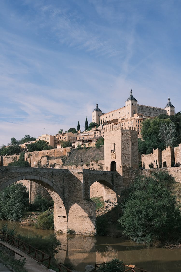 Roman Arch Bridge Puente De Alcantara And Alcazar Of Toledo In Spain