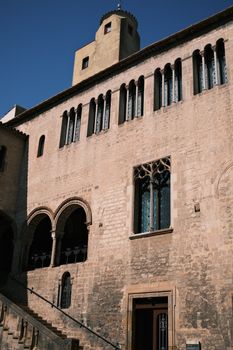 Facade of the historic Palacio Episcopal de Barcelona showcasing Gothic architecture.