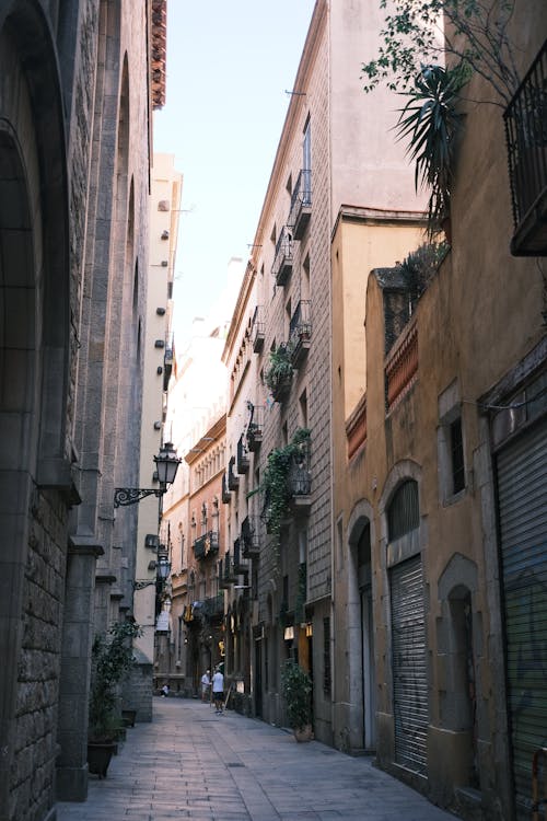 Narrow Alley between Buildings in City