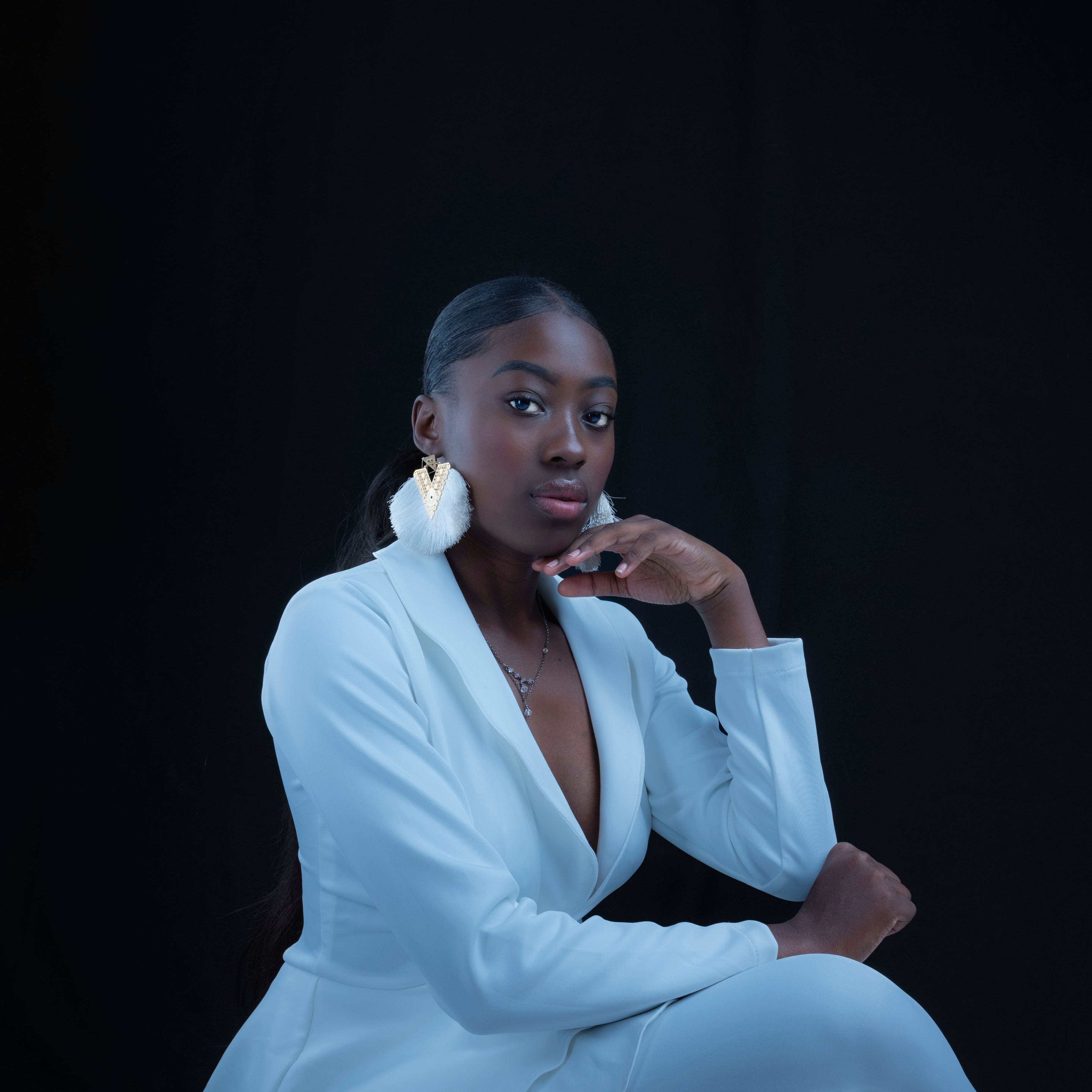 Woman Posing in White Suit · Free Stock Photo