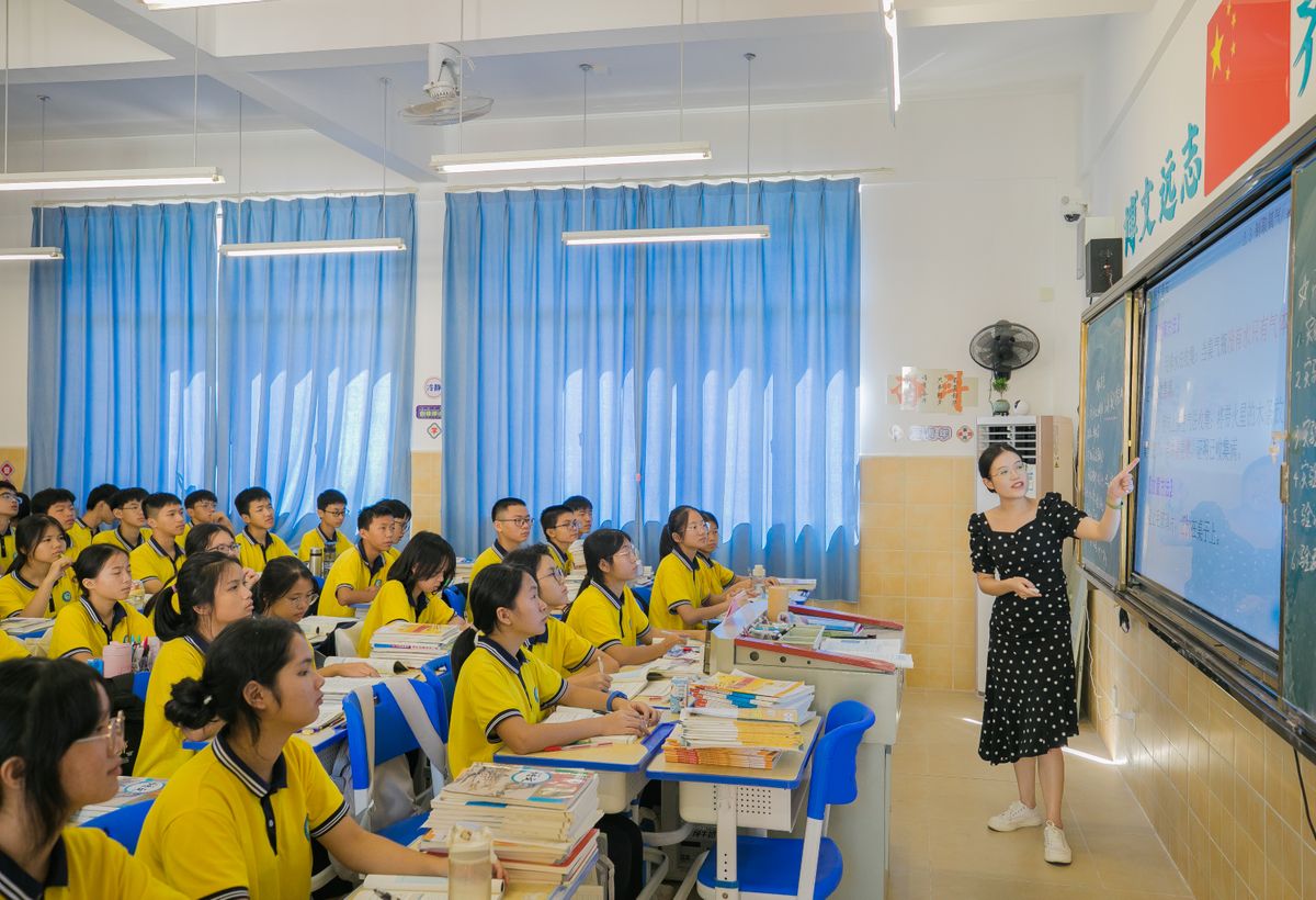 Teacher presents to attentive students in vibrant classroom setting