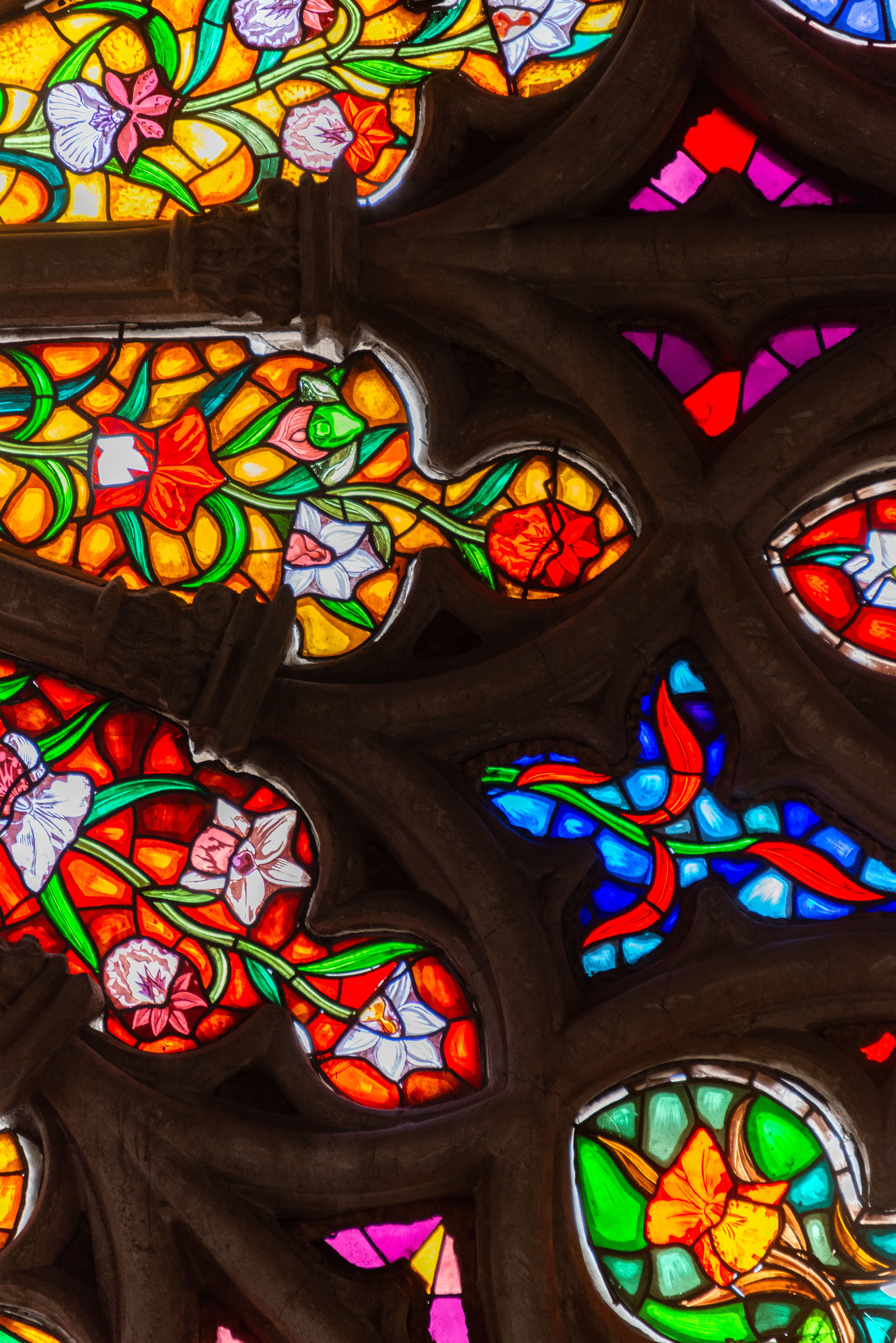 Vibrant stained glass window showcasing religious art in a church.