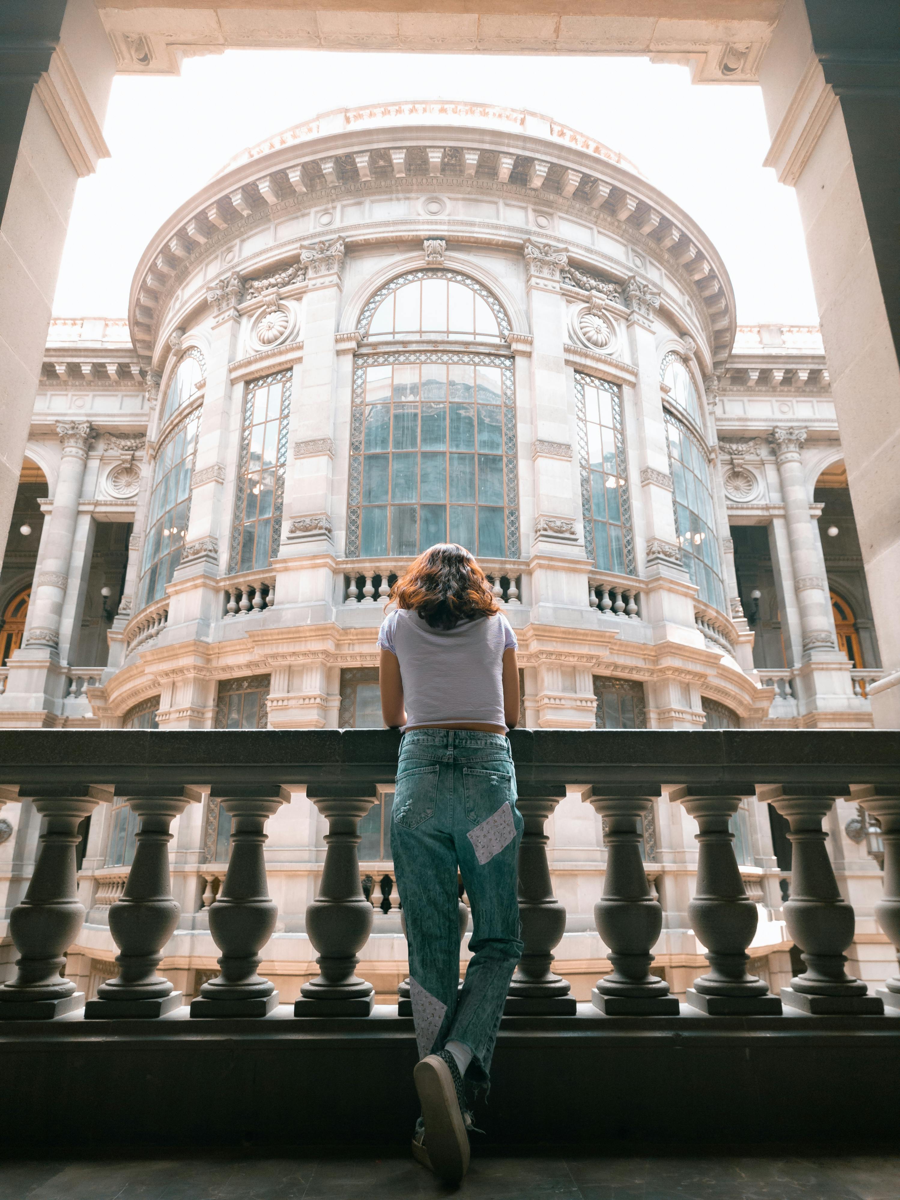 back view of a woman standing by the balustrade in the national museum of art in mexico city mexico