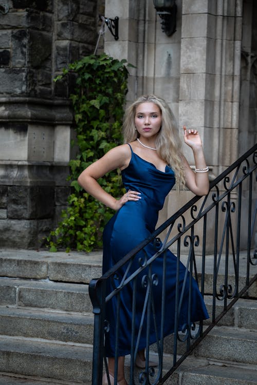 Blonde Model Posing in Dress on Stairs