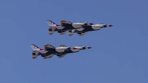 Free US Air Force Thunderbirds perform an aerial display in a clear sky over California. Stock Photo