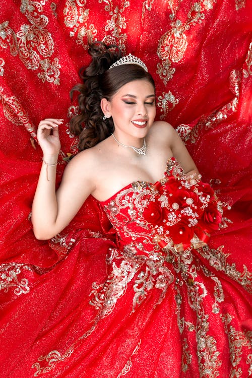 Brunette in Red Gown with Embellishments