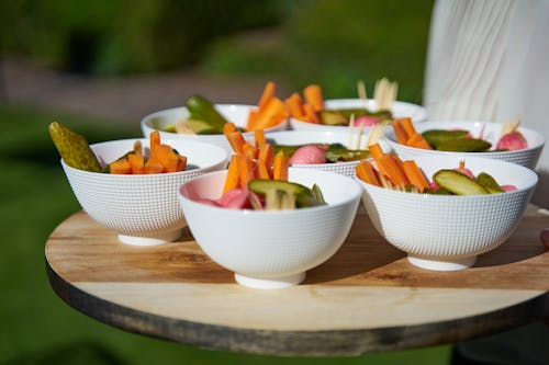 Bowls with Vegetables on a Wooden Tray