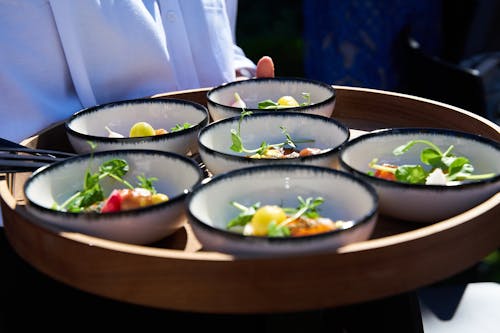 Bowls Carried on a Wooden Tray