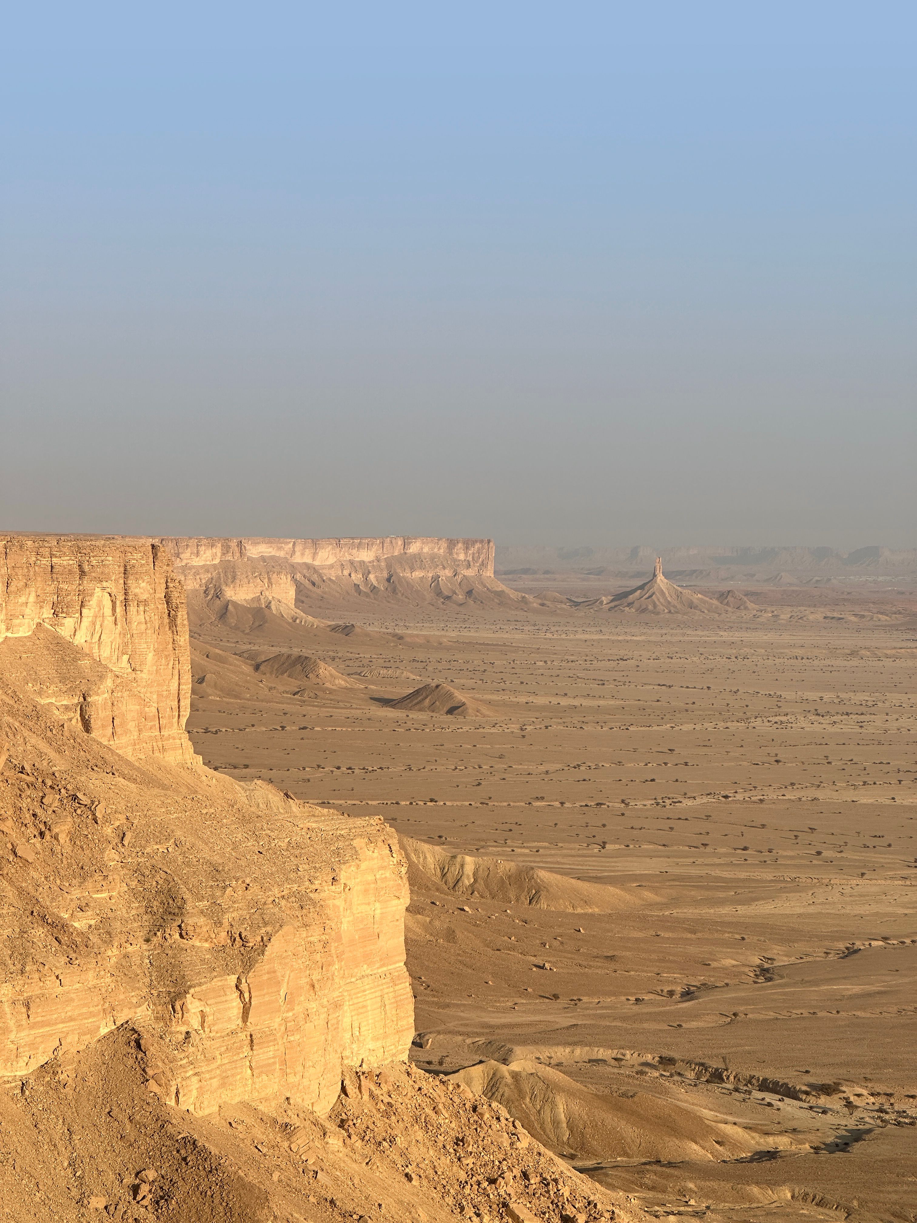 Stunning aerial view of the Tuwaiq escarpment and expansive desert landscape in Dhurma, Riyadh Province.
