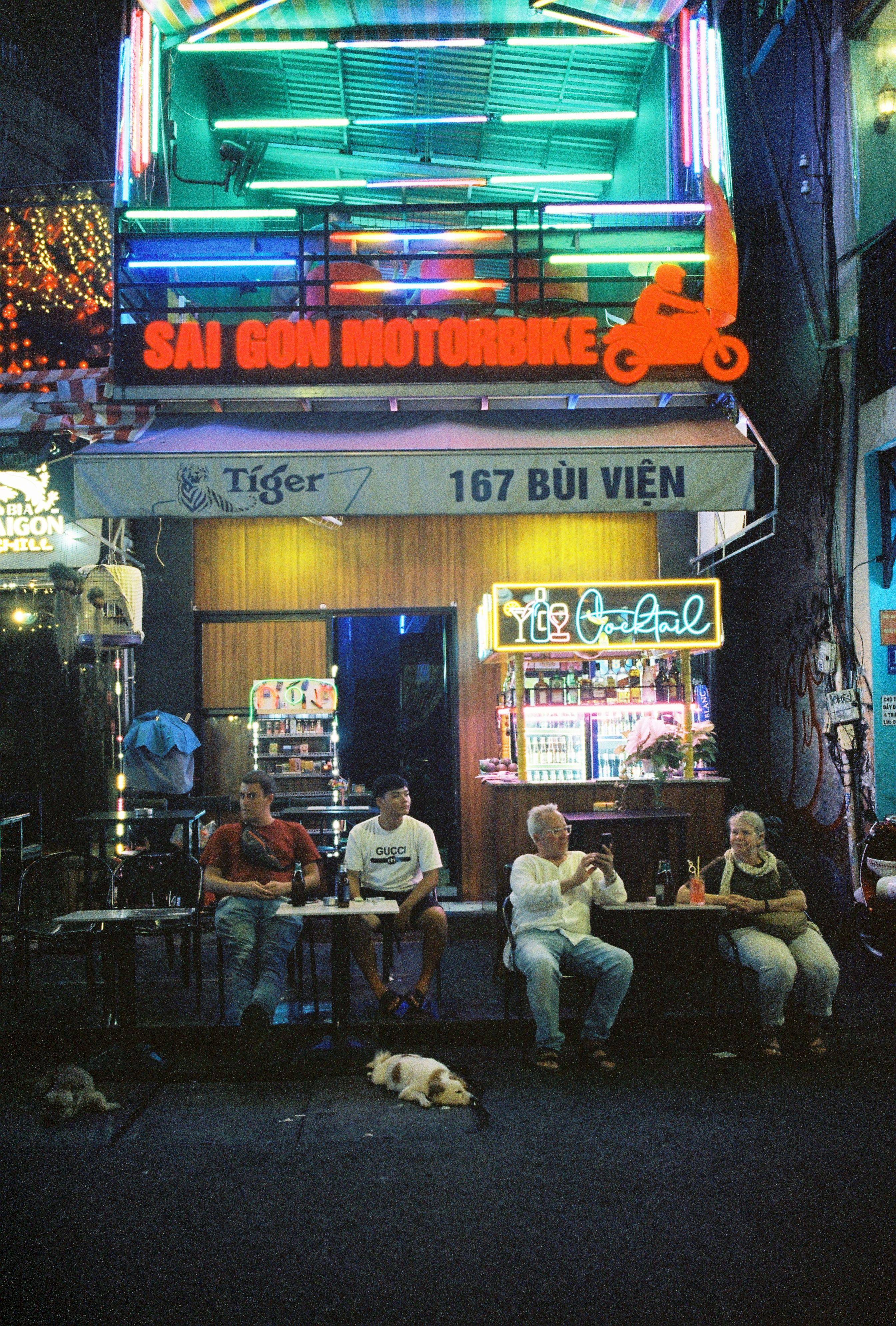 Vibrant nightlife on Bui Vien Street in Ho Chi Minh City with people and colorful lights.