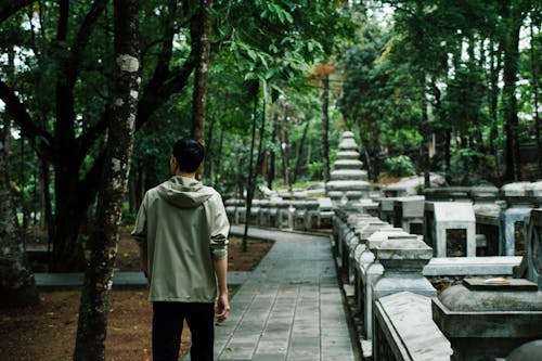 Back View of a Man Walking around the Tu Hieu Pagoda in Hue, Vietnam