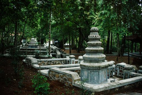 Free Explore the tranquil Tu Hieu Pagoda surrounded by lush greenery in Hue, Vietnam, offering a peaceful retreat. Stock Photo