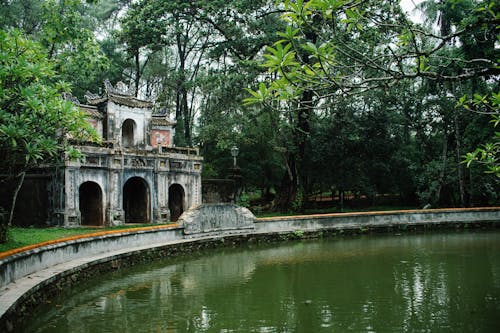 View of a Pond and Historical Buildings at the Tu Hieu Pagoda in Hue, Vietnam