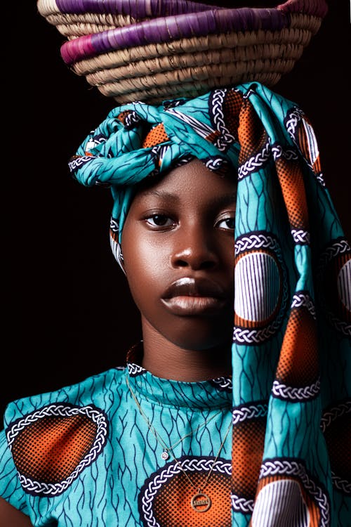 Model in Traditional Patterned Dress and Headscarf