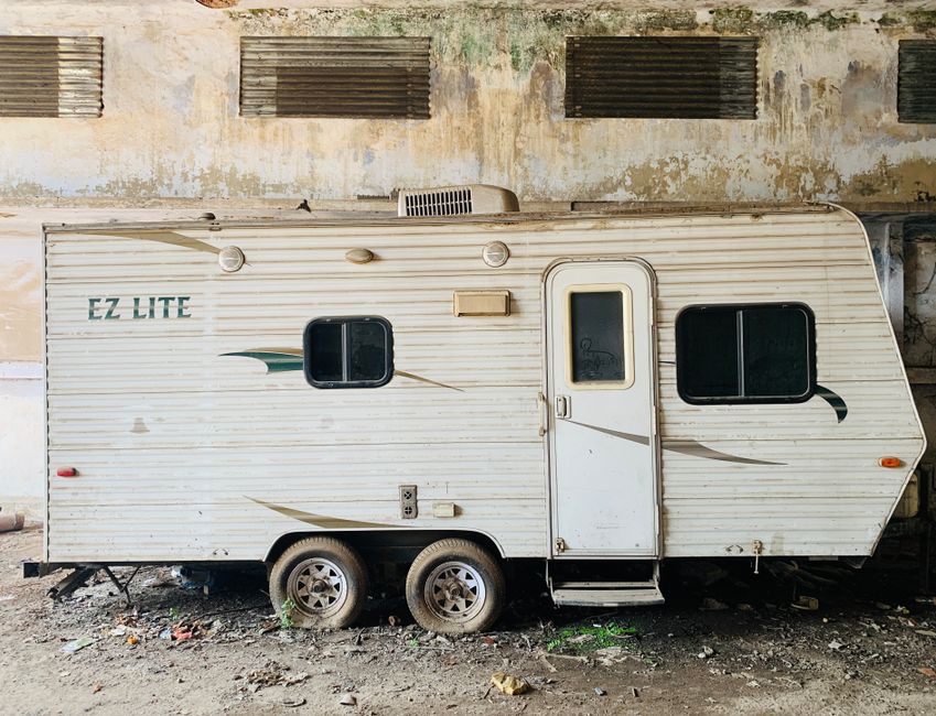 A split image showing a travel trailer damaged by a fallen tree branch on one side, and a pristine travel trailer on the other. Alt-text: Before and after image demonstrating the need for comprehensive travel trailer insurance. - do you need insurance on a travel trailer in florida A split image showing a travel trailer damaged by a fallen tree branch on one side, and a pristine travel trailer on the other. Alt-text: Before and after image demonstrating the need for comprehensive travel trailer insurance. - do you need insurance on a travel trailer in florida