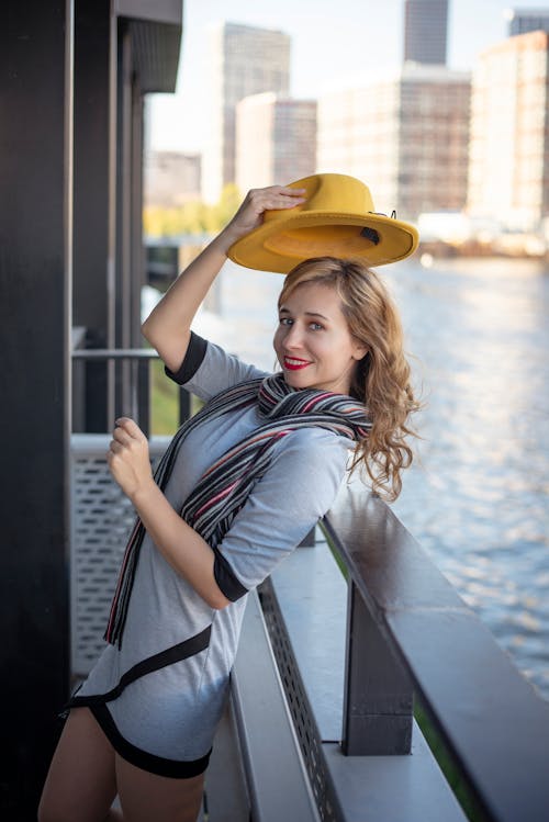 Smiling Woman Posing with Hat