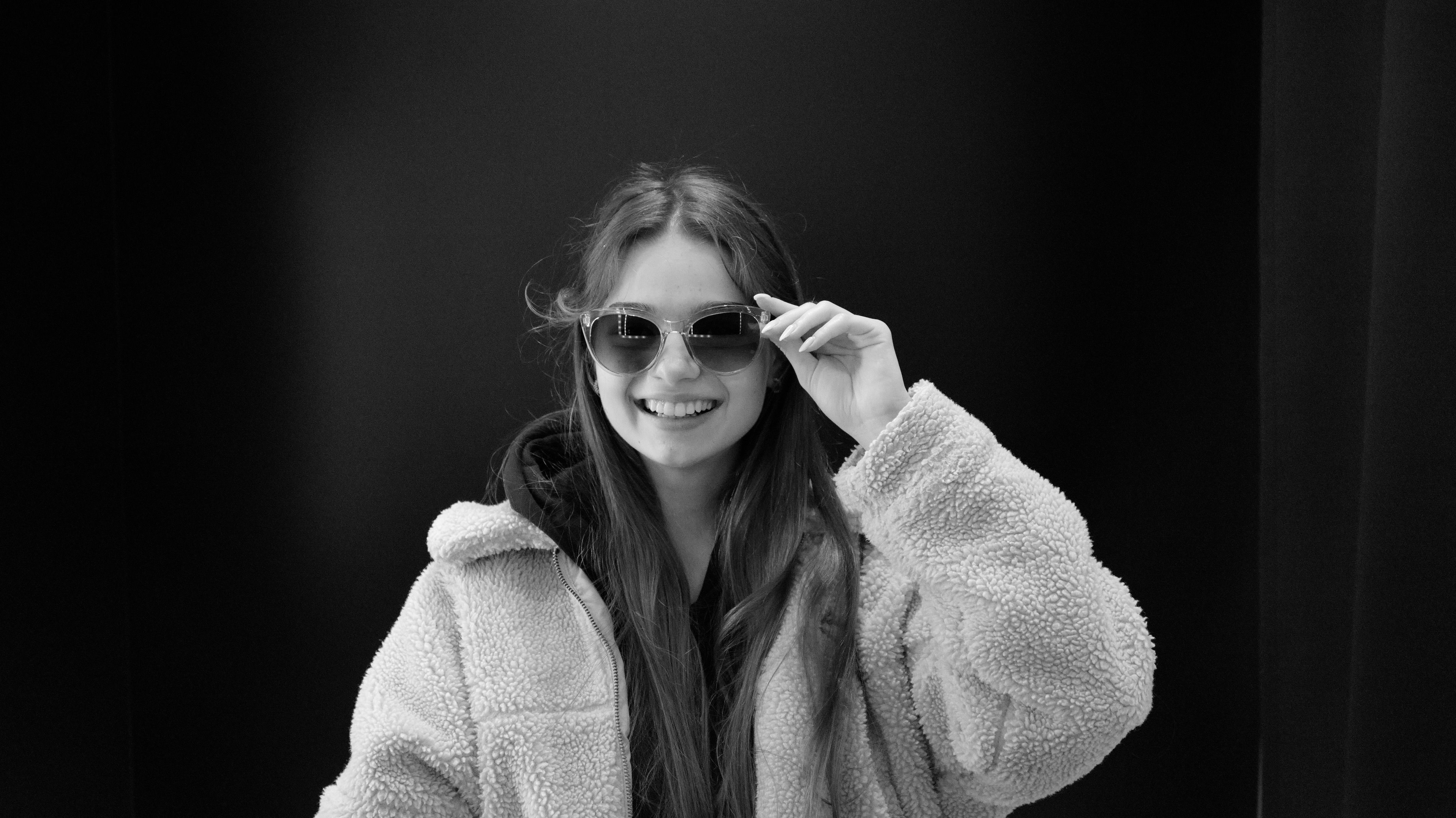Young Woman in a Jacket and Sunglasses · Free Stock Photo