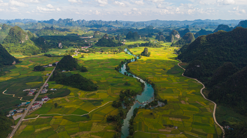 Free Explore the serene landscapes of Cao Bằng with lush valleys and winding rivers captured from above. Stock Photo