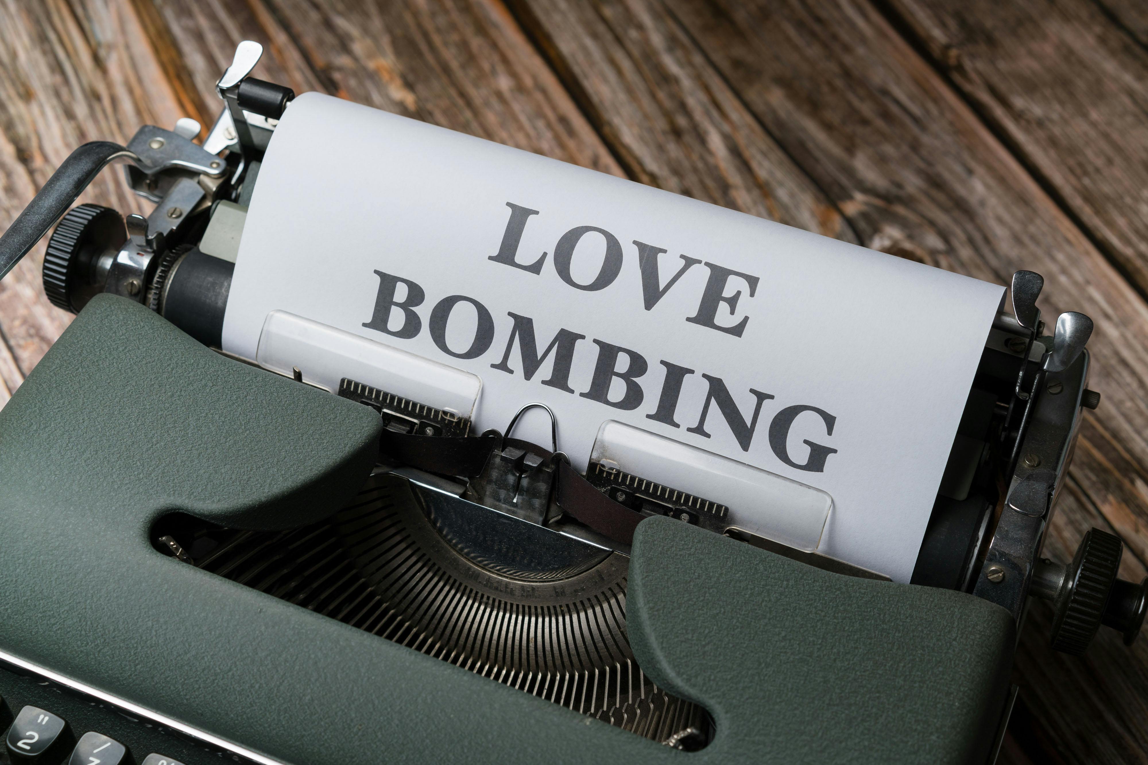 a typewriter with the word love bombing on it