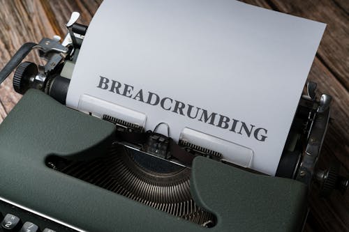 A typewriter with the word breadcrumbing on it